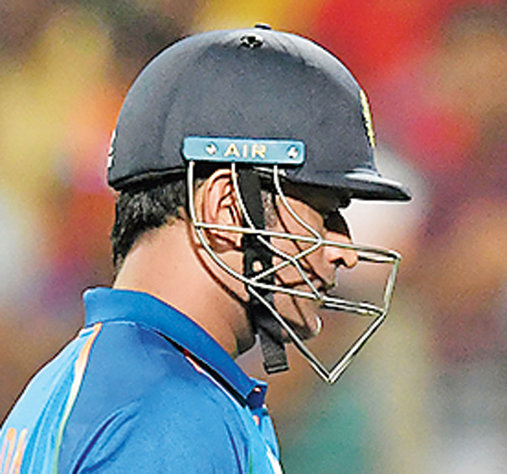 Mahendra Singh Dhoni after getting out during the third ODI cricket match between India and West Indies in Pune