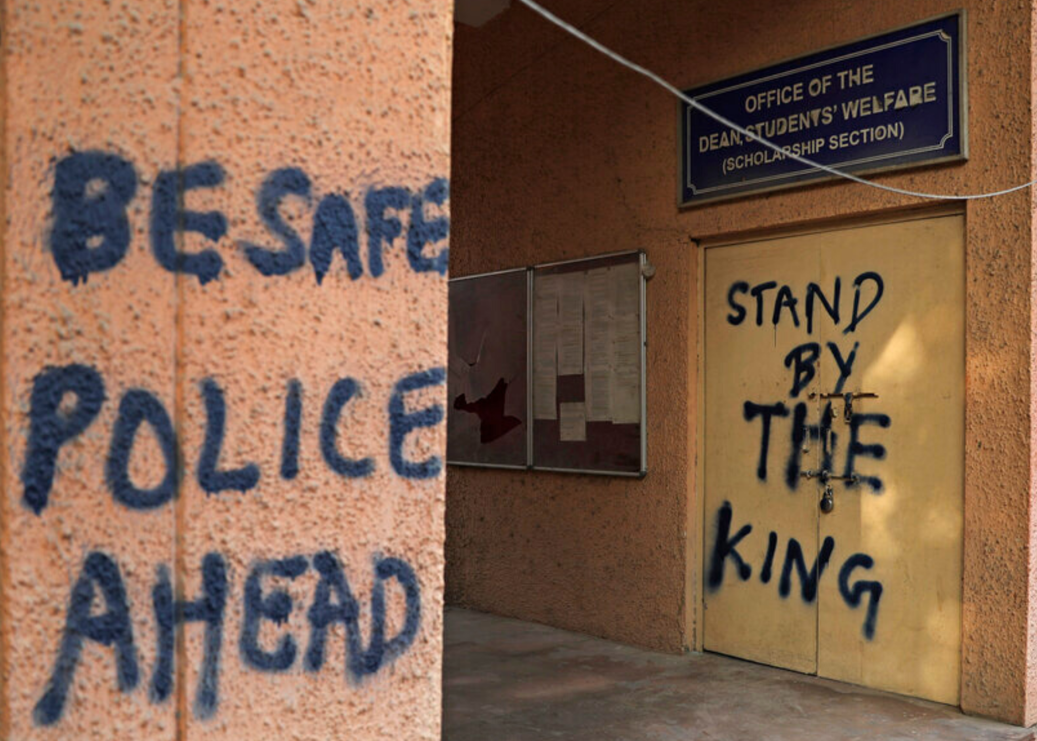 Graffiti in Jamia Millia Islamia that reads "Be safe police ahead," spray-painted in the university