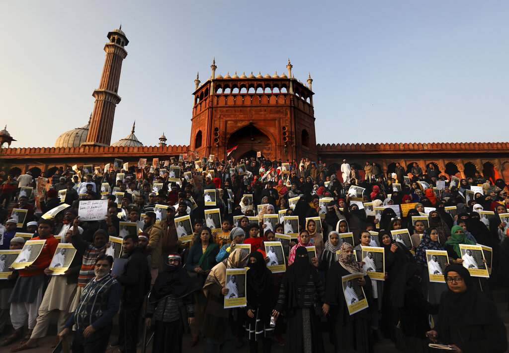 People hold placards during a protest against new citizenship law at Jama Masjid, in New Delhi, on Thursday