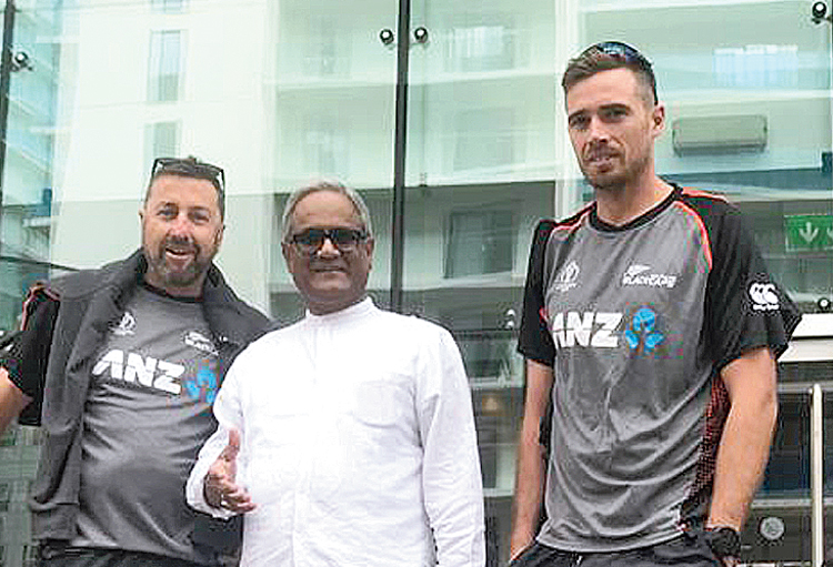 Rabin Chakraborty with seamer Tim Southee (right) and another member of the New Zealand squad.
