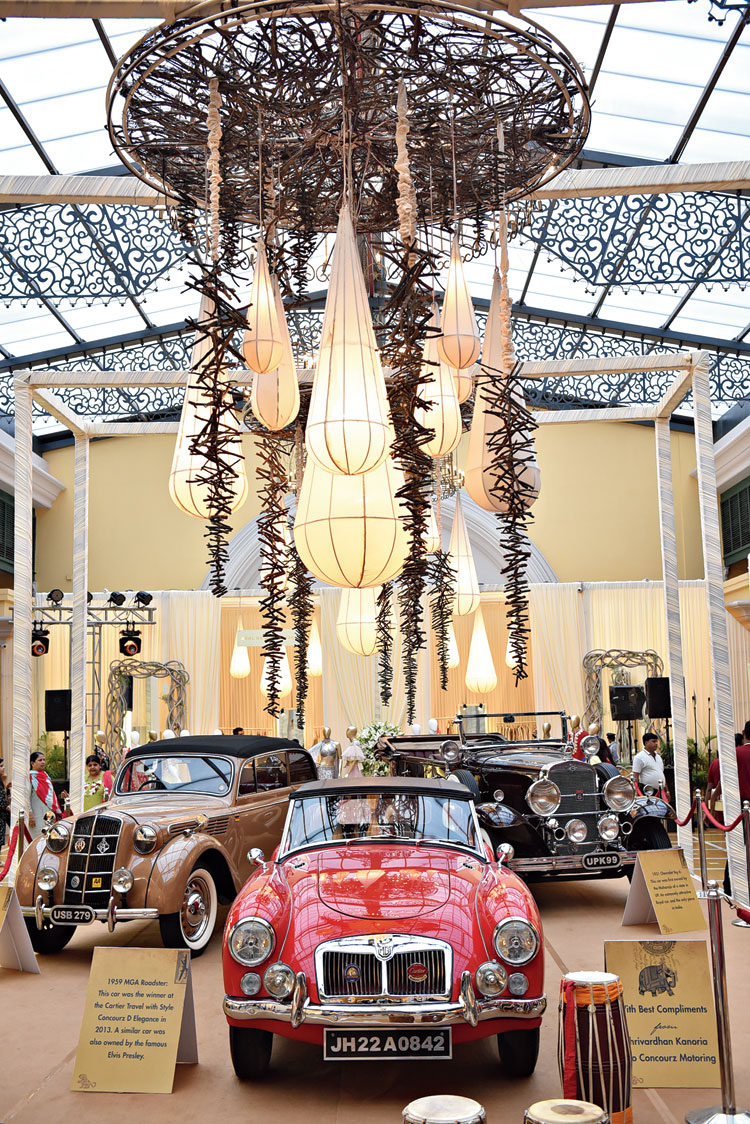 From the conservatory-like roof of RaasManch that lets sunlight stream in, hung the Teardrop Chandelier in muted tones of cream, providing a neutral palette for a fleet of vintage cars — a red 1959 MGA Roadster, a 1937 Opel Cabrio in Havana brown and a maroon 1931 Chevrolet Big 6, courtesy Concourz Motoring by Shrivardhan Kanoria.