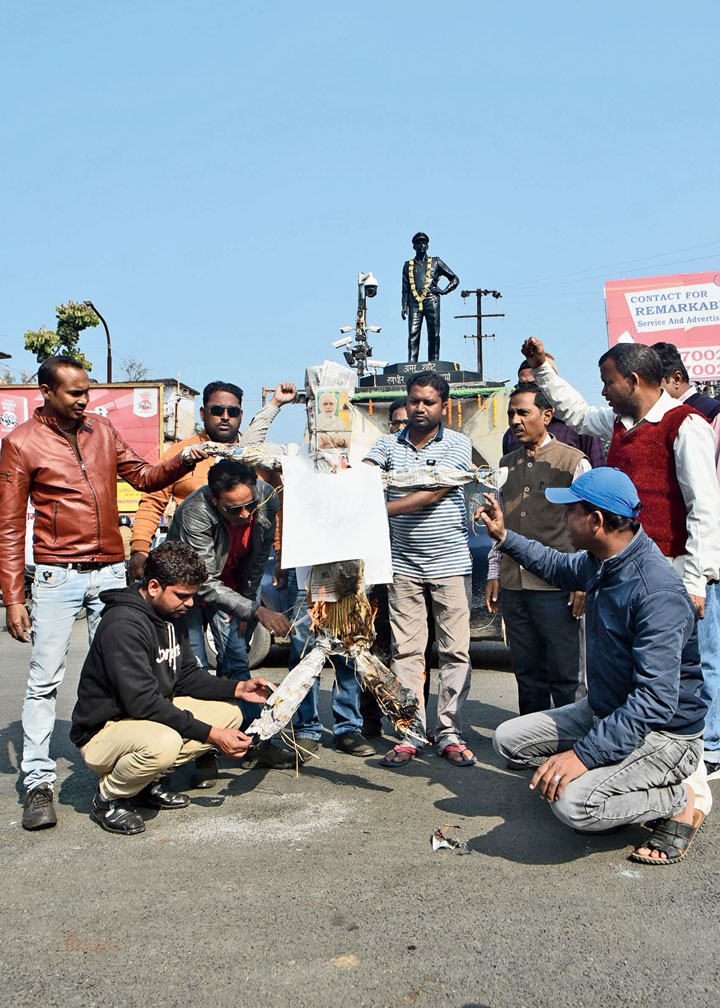 Members of Ravidas Samaj Sangharsh Samiti burns home minister Amit Shah’s effigy at Randhir Verma Chowk in Dhanbad on Monday. 