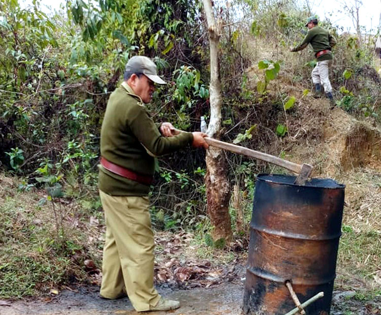Officials destroying units making illicit liquor in Golaghat on Saturday