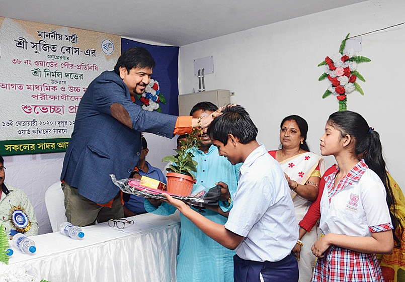 Minister Sujit Bose blesses a candidate at the Duttabad programme. 