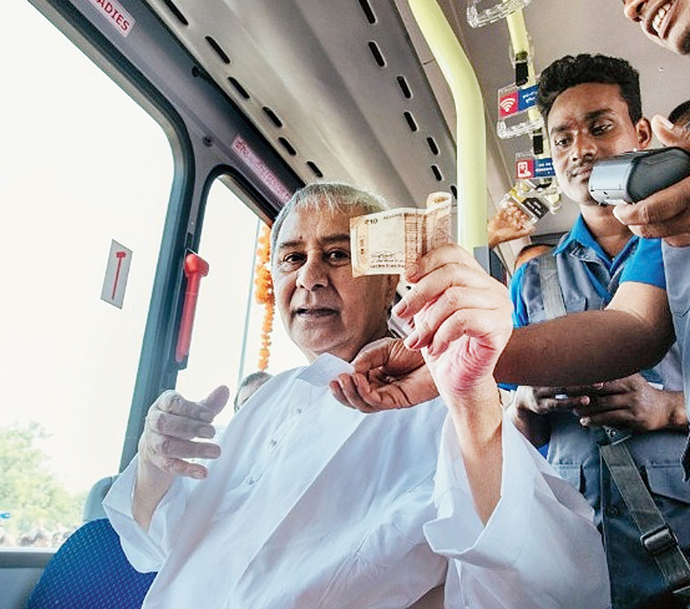 Naveen Patnaik takes a ride to inaugurate the bus service in Bhubaneswar on Tuesday. 