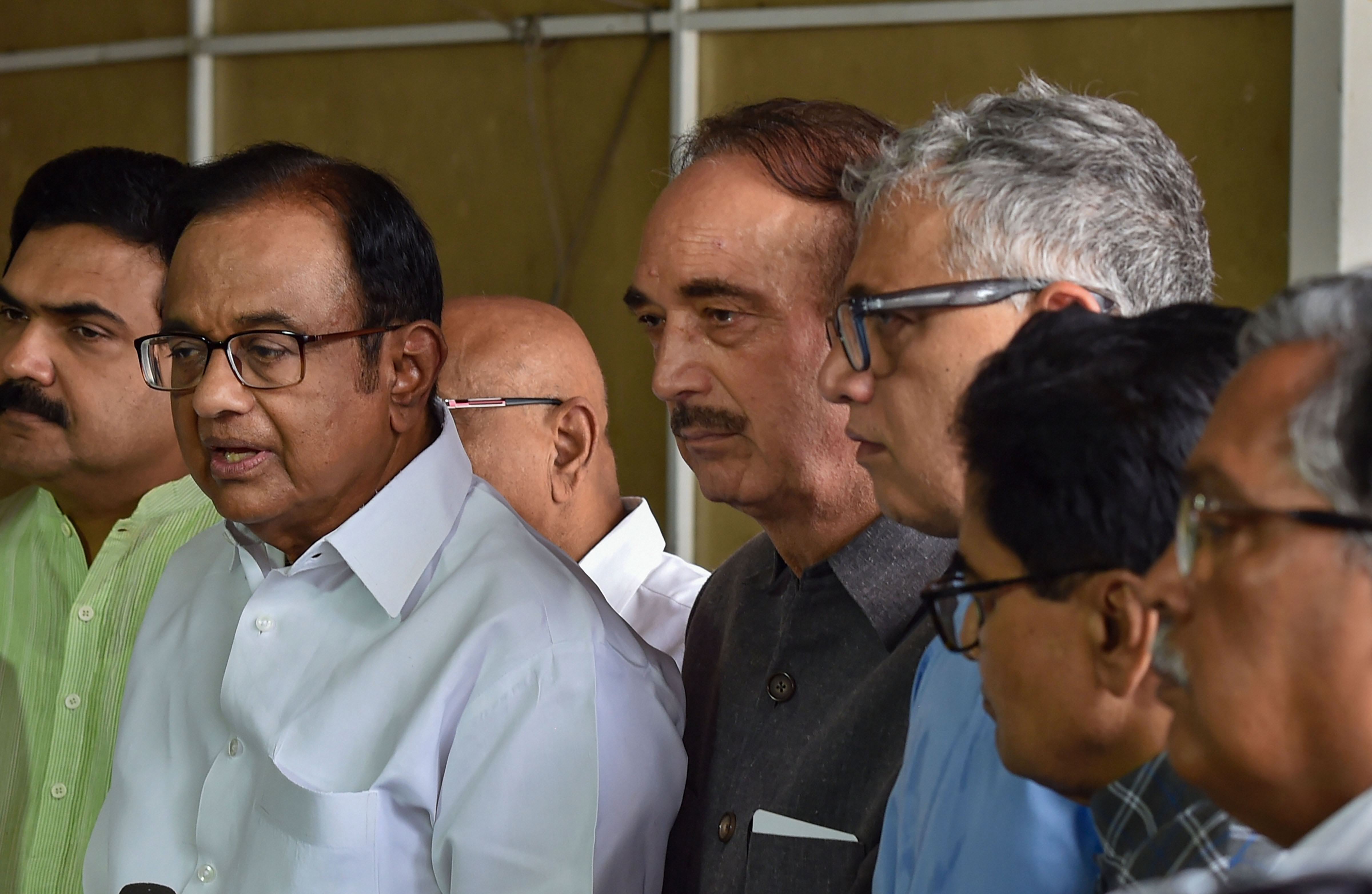 Ghulam Nabi Azad, leader of Opposition in the Rajya Sabha (centre, in black) and others look on as Congress leader P. Chidambaram (to his right) addresses the media regarding the Union government's move on Article 370, at the Parliament in New Delhi on Monday, August 5, 2019.