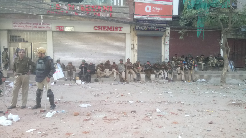 Police officers in Maujpur in northeast Delhi on Tuesday