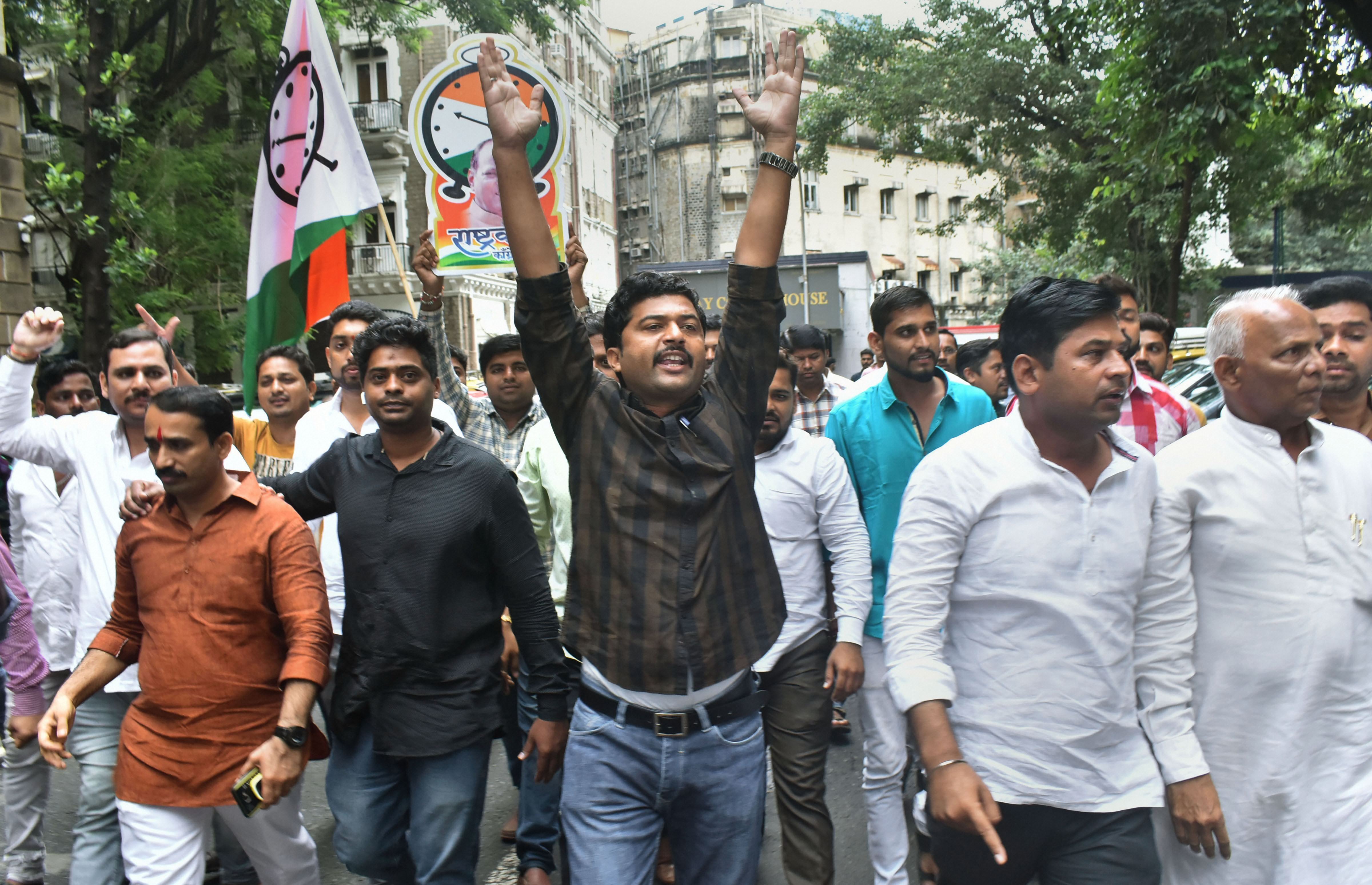 Youth wing of the Nationalist Congress Party (NCP) stage a protest to condemn the registration of a money laundering case against party chief Sharad Pawar and others in connection with the MSCB Bank scam, in Mumbai, Wednesday, September 25, 2019.