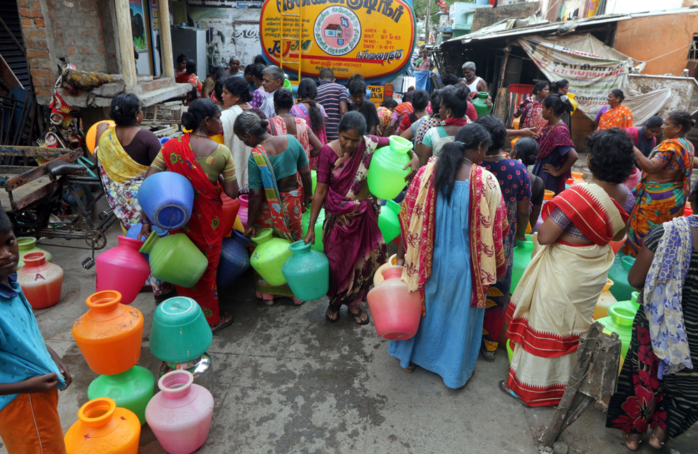 Chennai residents jostle to fill vessels from a tanker. The scale of the water crisis can perhaps be adjudged from Chennai’s present troubles