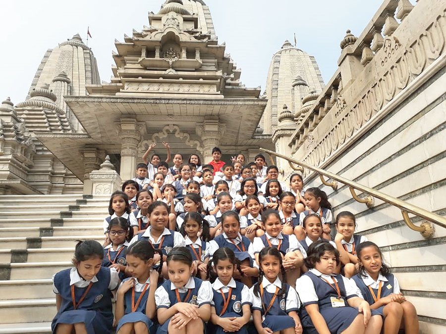 The Class III students on the steps of a temple in Ballygunge
