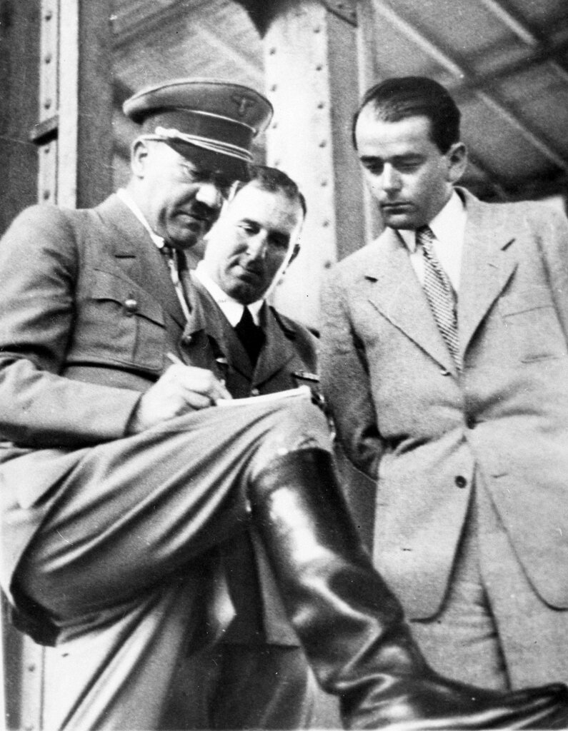 In this file photo dated February 19, 1937, German Chancellor Adolf Hitler (left) discusses plans for building a convention hall at Nuremberg with Lord Mayor Willy Liebel (centre) and Prof. Albert Speer at Nuremberg, Germany.