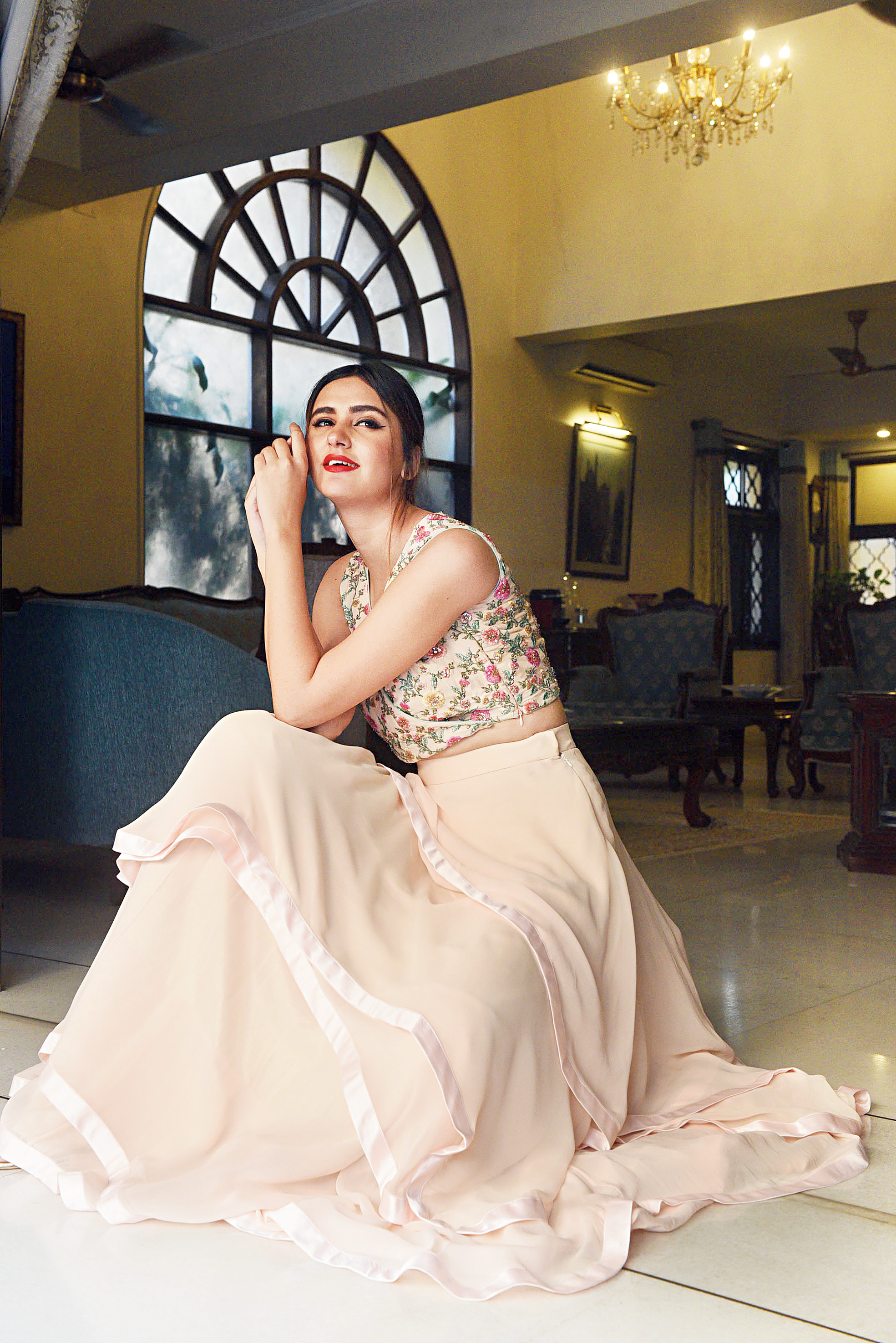 Dreamy overlap pink cropped blouse embroidered with Badla, resham and pearl work, organza georgette layered skirt with satin detailing.