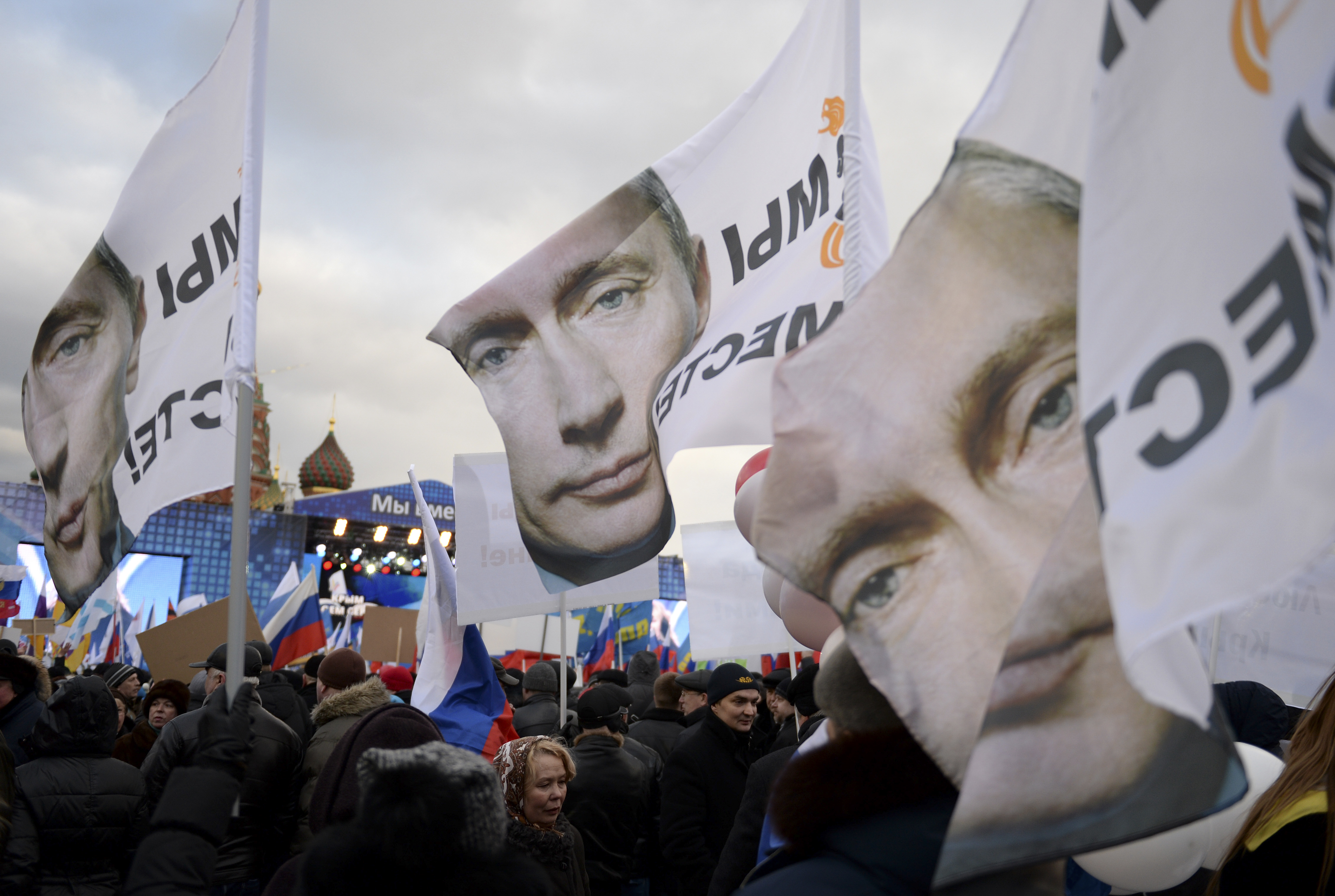 Banners in Moscow's Red Square bear the portrait of Russian President Vladimir Putin and the slogan “We Are Together,” referring to Russia and Crimea, which Russia seized from Ukraine. 