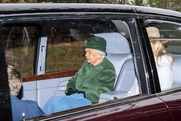 Queen Elizabeth leaves after attending a service at St Mary Magdalene Church in Norfolk on Sunday. 