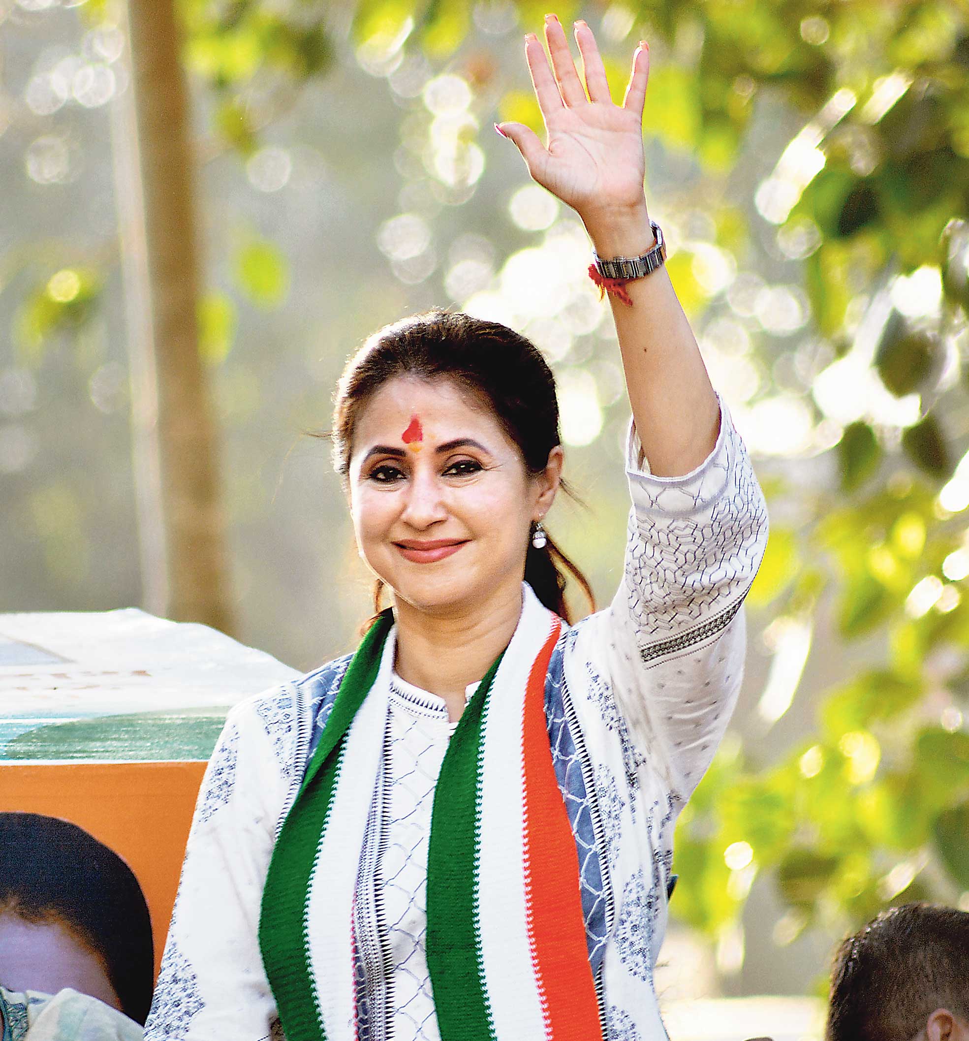 Urmila Matondkar waves at party supporters during her election campaign for the Lok Sabha polls, at Kandivali in Mumbai, April 20, 2019. 