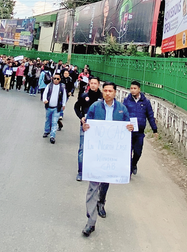 The members of the confederation hold placards in Shillong on Monday 
