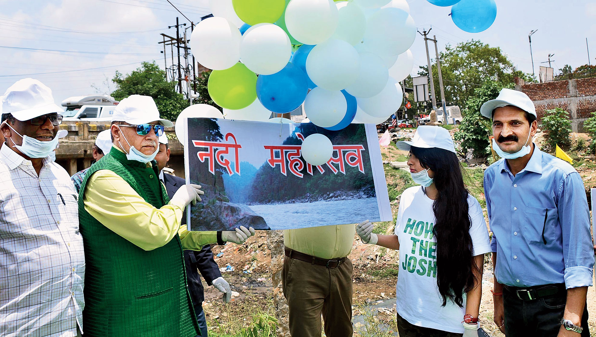 Justice SN Pathak (in green bundi) at the planting drive along the Harmu rivulet in Ranchi on Sunday. 