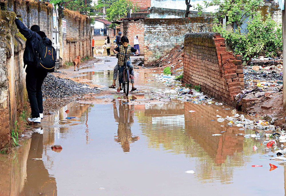Dare to walk: A waterlogged street at Tunkitola in Ranchi on Tuesday. 
