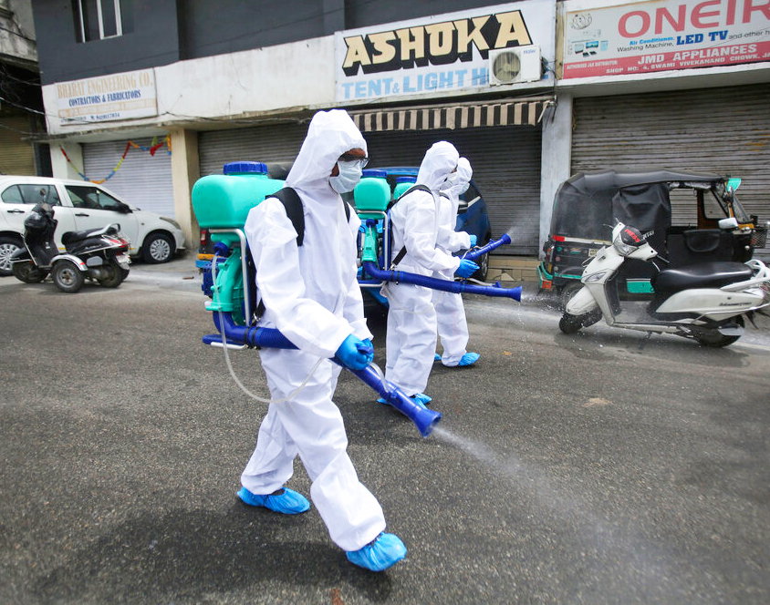 Indian municipal workers disinfect an area during lockdown to prevent the spread of coronavirus in Jammu, Thursday, April 16, 2020. 
