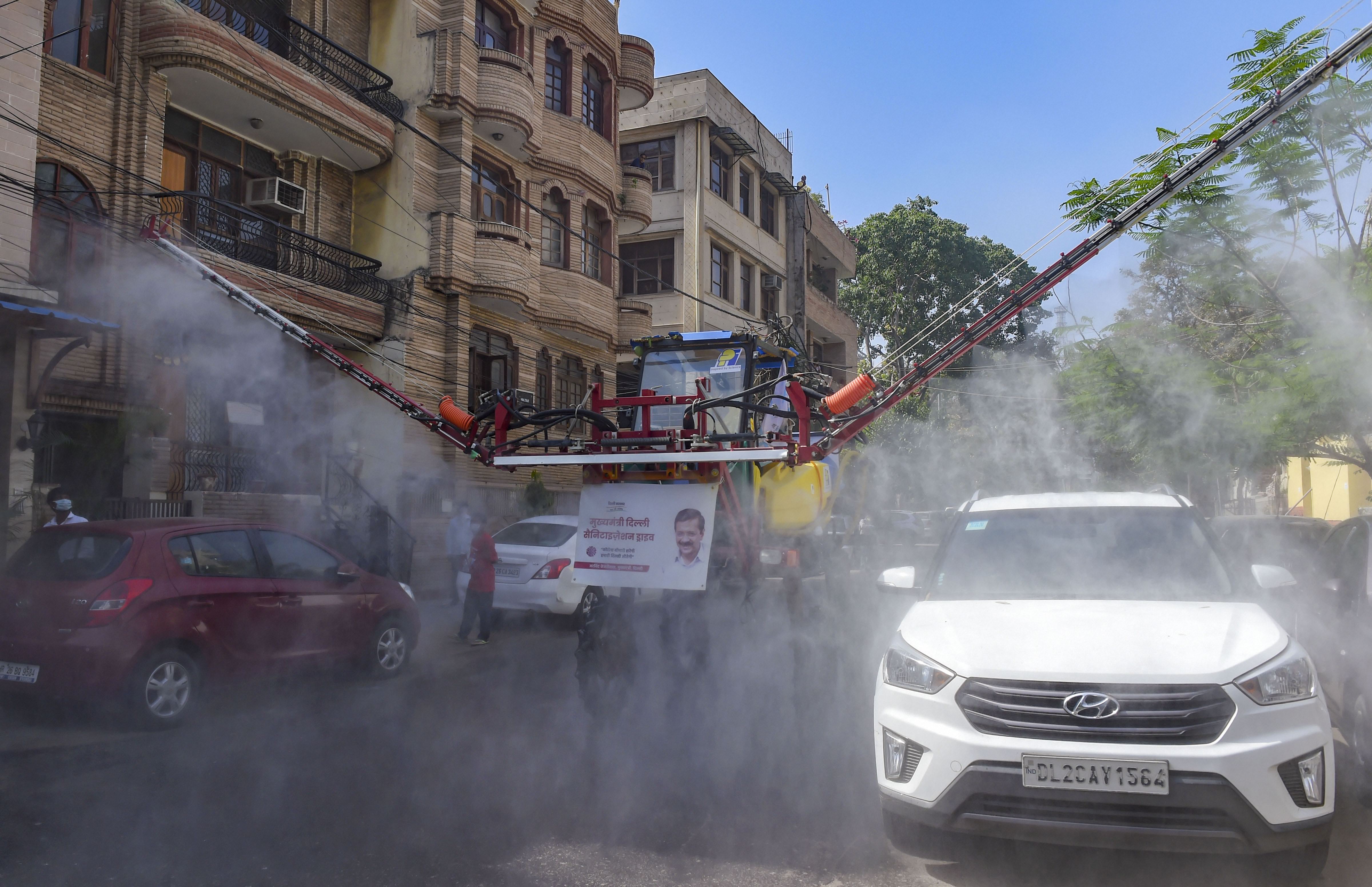 A pilot operates a Japanese spray machine for sanitizing a locality near Rajendra Nagar Market, during the nationwide lockdown to curb the spread of coronavirus, in New Delhi, Monday, April 13, 2020. The machine can sanitize 20,000 sq metres per hour