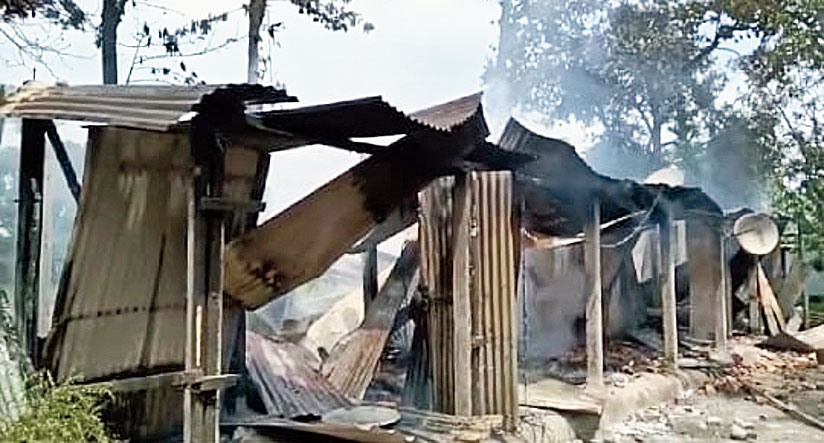 The torched houses of the victims at Athiabari village in Baksa district on Wednesday. 
