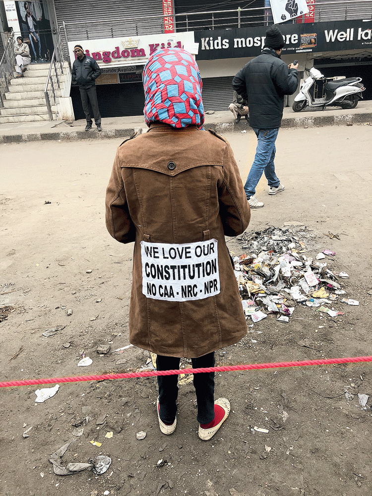 A shivered schoolgirl sends her message to the government on the sidelines of the sit-in