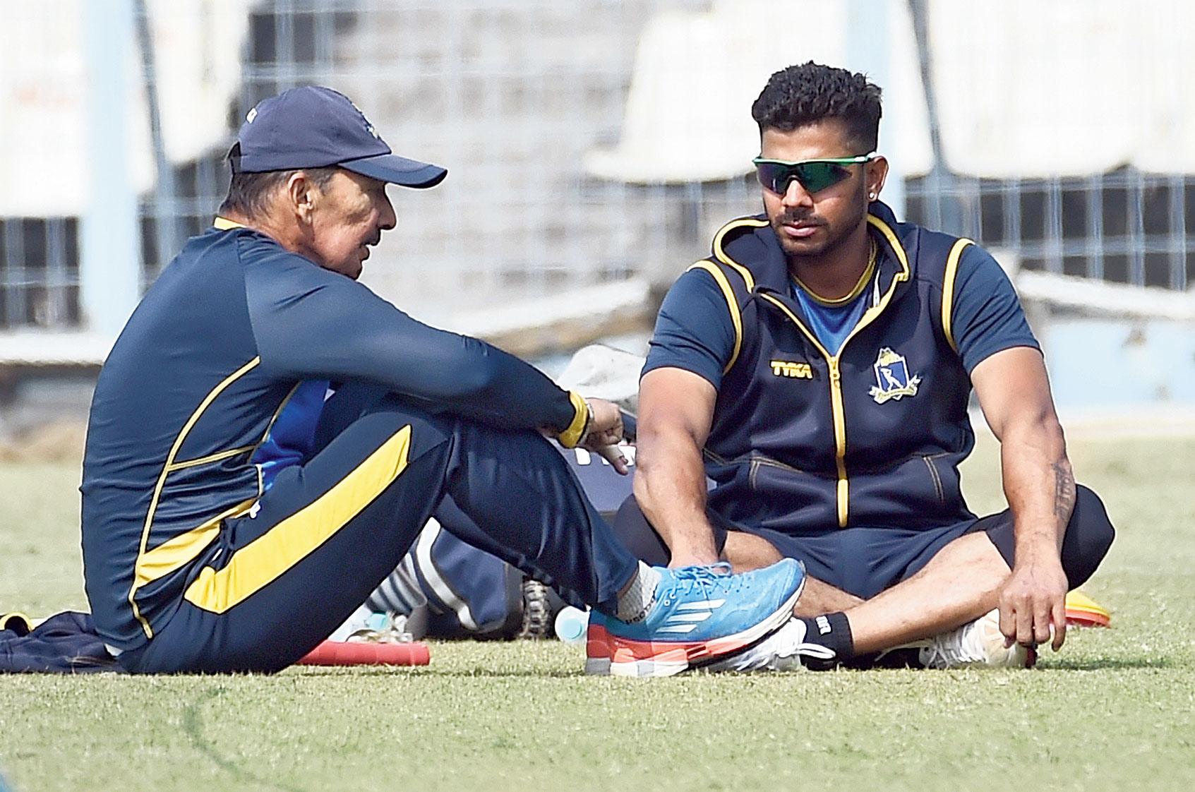 Bengal coach Arun Lal and Manoj Tiwary discussing a point during a training session