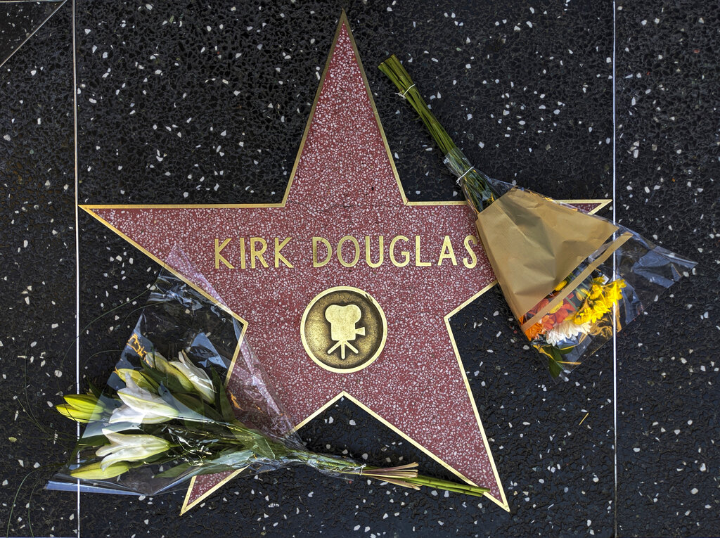 Flowers are placed on actor Kirk Douglas' star on the Hollywood Walk of Fame in Los Angeles, on Wednesday, February 5, 2020. Douglas, the muscular actor with the dimpled chin who starred in "Spartacus," "Lust for Life" and dozens of other films and helped fatally weaken the Hollywood blacklist, has died at 103.