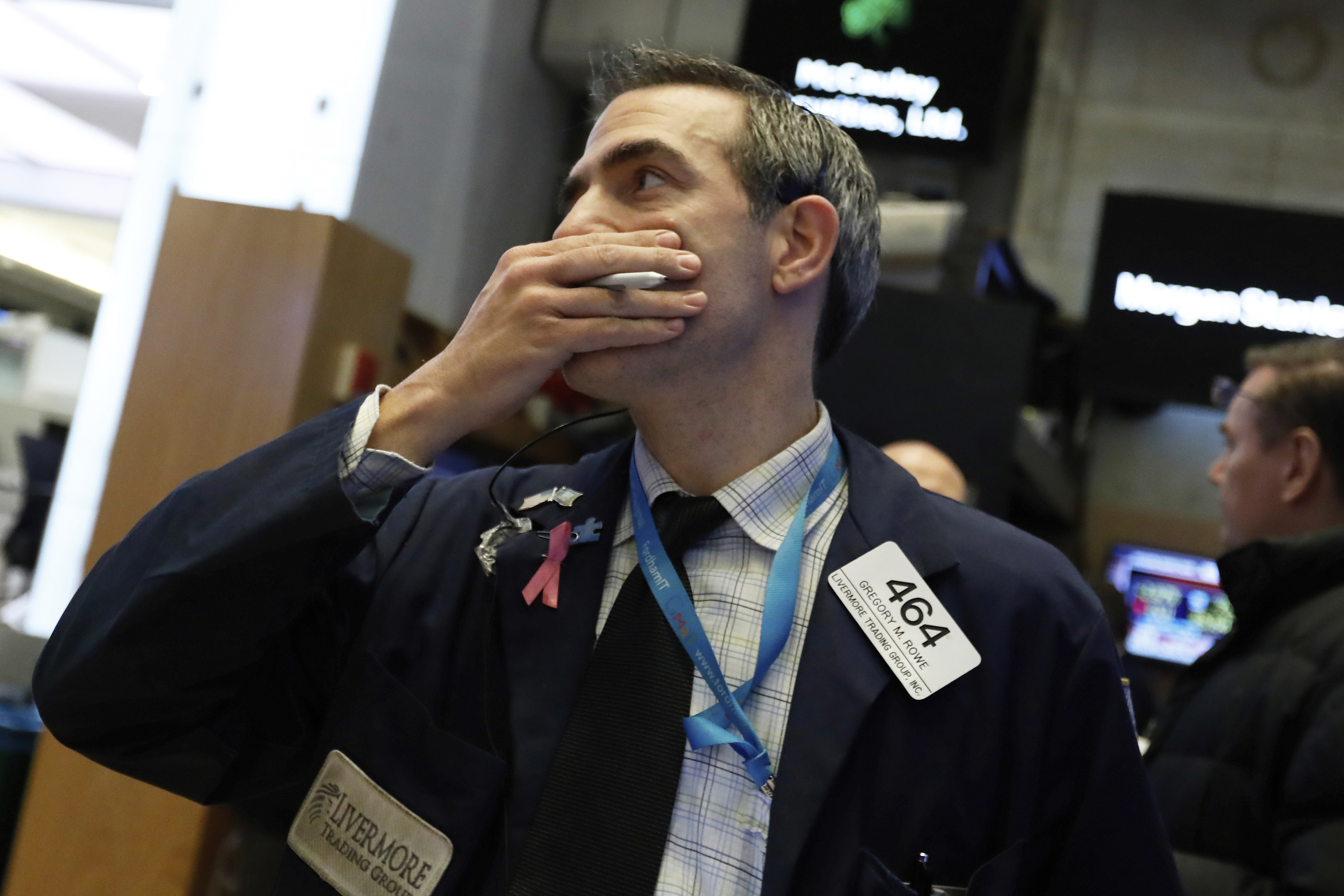 Trader Gregory Rowe works on the floor of the New York Stock Exchange on Wednesday. The Dow Jones Industrial Average plunged more than 800 points, its worst drop in eight months, led by sharp declines in technology stocks. 