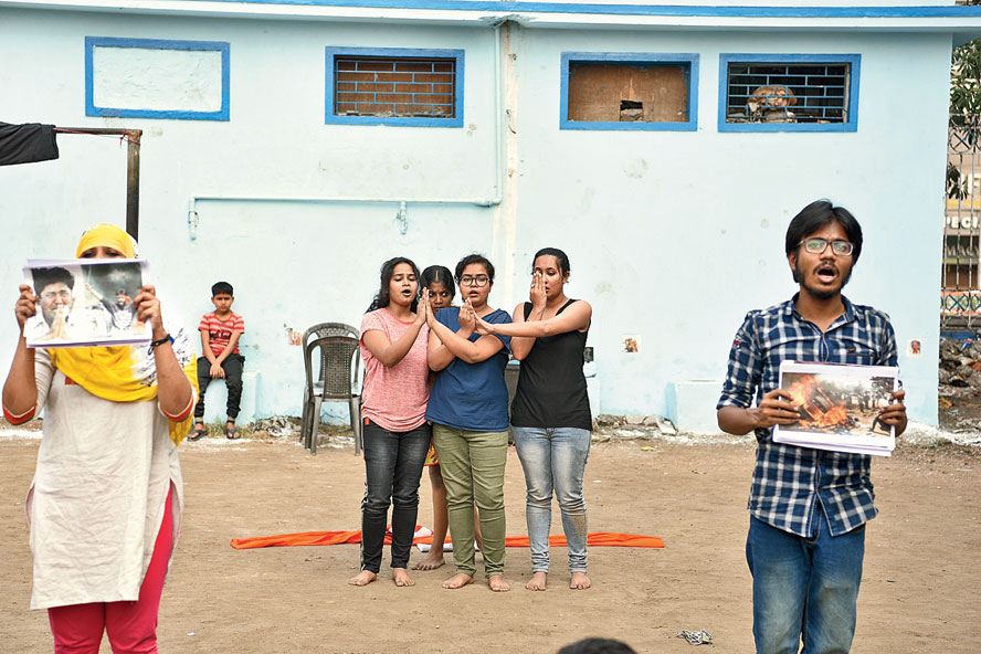 A group of students from Jadavpur University, Calcutta University and Bethune College enacted theatre of assault over half an hour at the start of the event. Short plays, each lasting two minutes, on different themes were presented by Iskra. A scene in one of the plays depicted the horror of the Gujarat riots of 2002. Kinkini Sengupta, the lead performer of the group, said they wanted to show the brutalities of the riot such as a seven-month-old foetus being pulled out of a woman’s womb. “The photograph of Qutubuddin Ansari was chosen to highlight the terror that has gripped the minority community yet again,” Sengupta said. Ansari, a tailor, was the face of the Gujarat riots in 2002 when he was photographed pleading with folded hands with a rampaging mob.