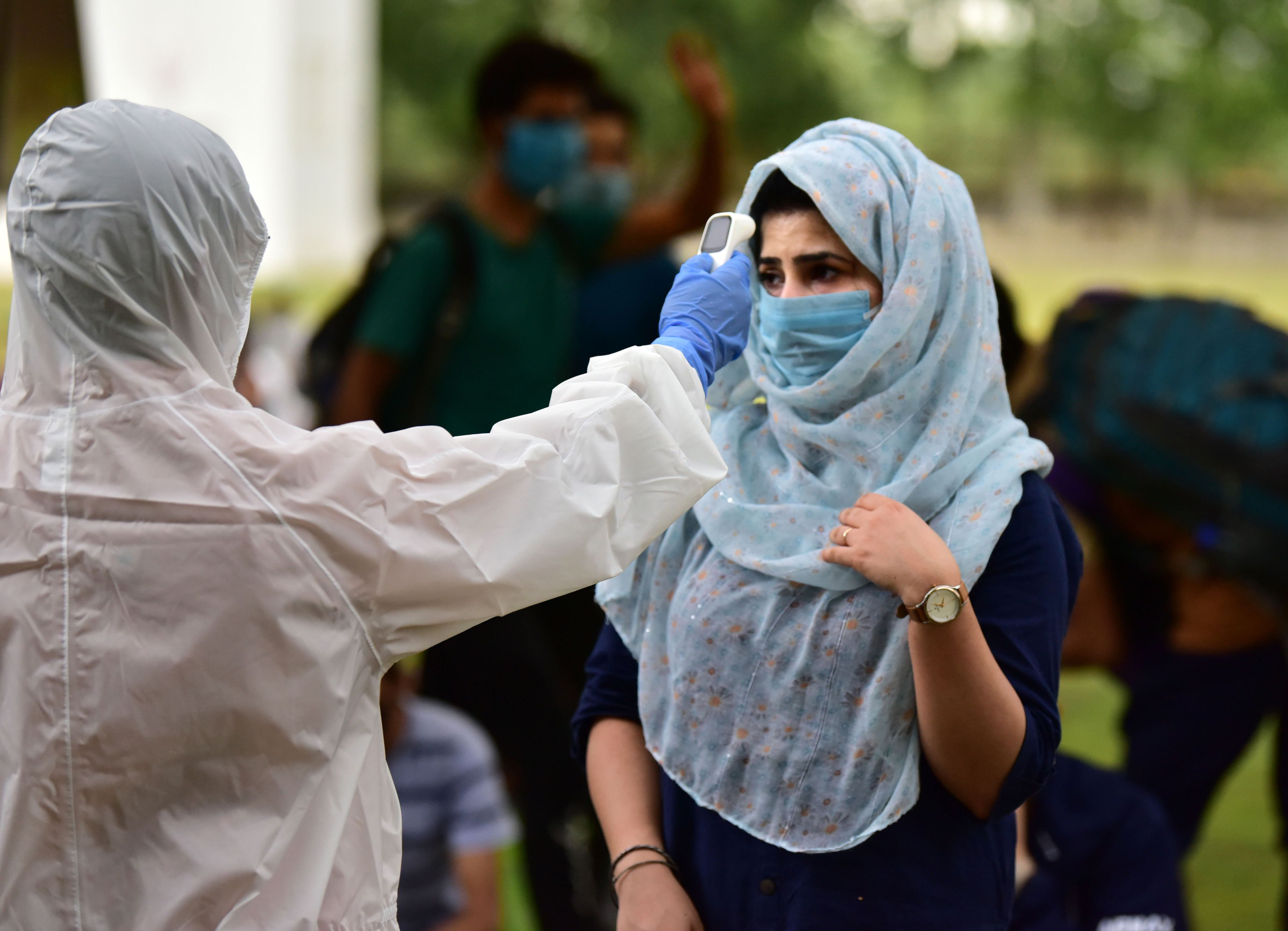 Stranded students from Jammu & Kashmir undergo thermal screening before leaving for their native places, during the ongoing COVID-19 lockdown, in Bhopal, Saturday, May 09, 2020.