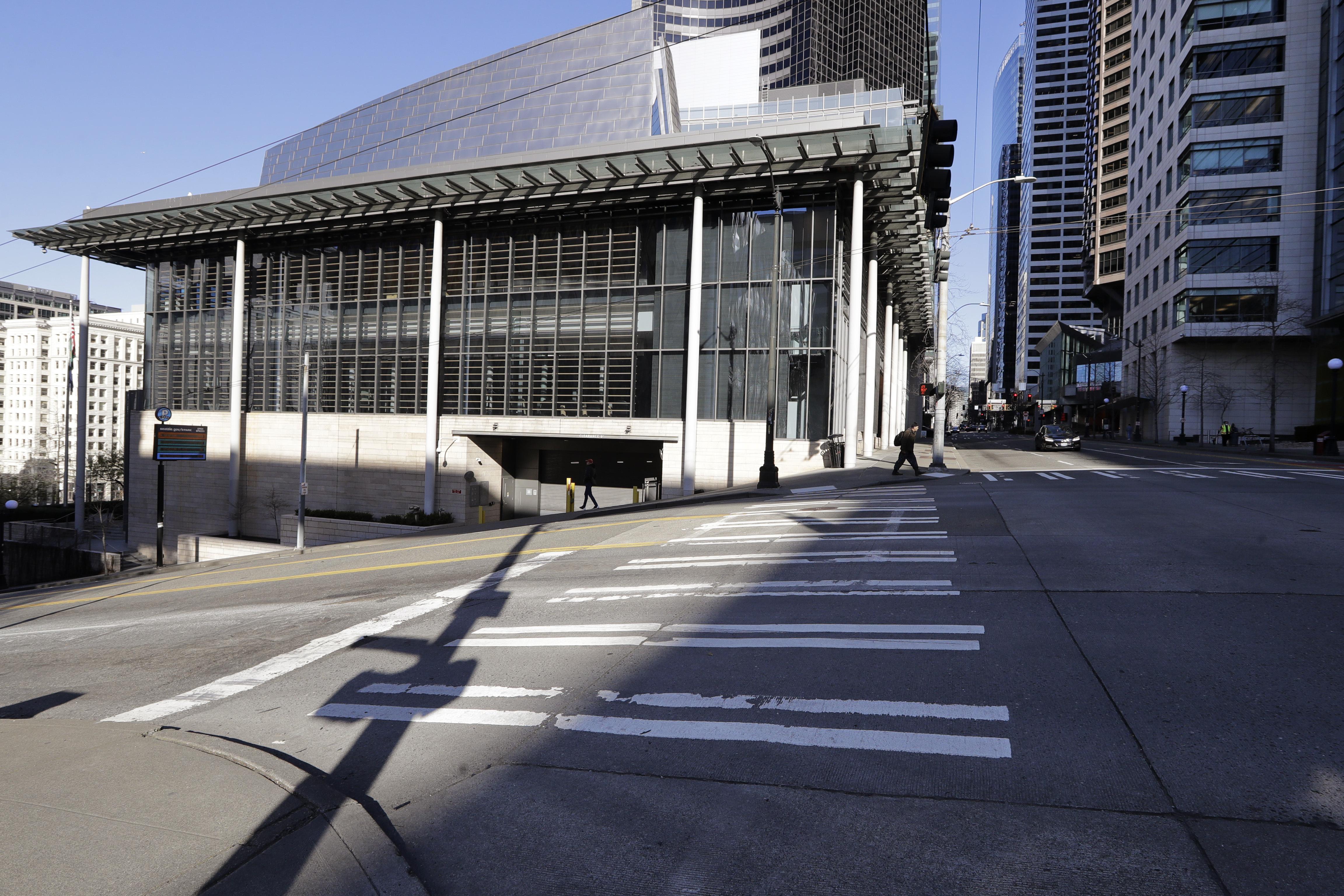 Normally bustling streets are nearly deserted adjacent to Seattle City Hall, where workers there and most in the area have been asked to work from home on Monday