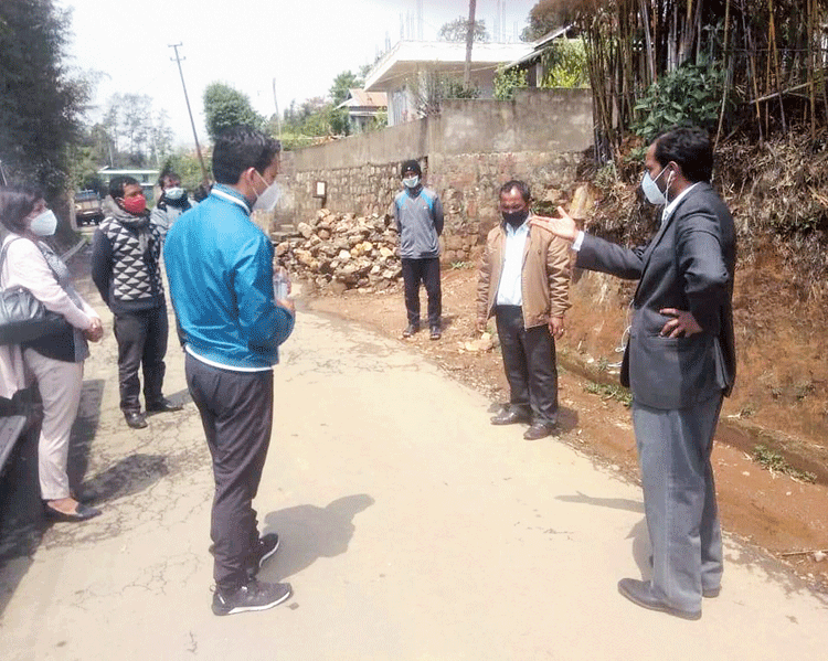 Officials interact with the villagers on Saturday. 

