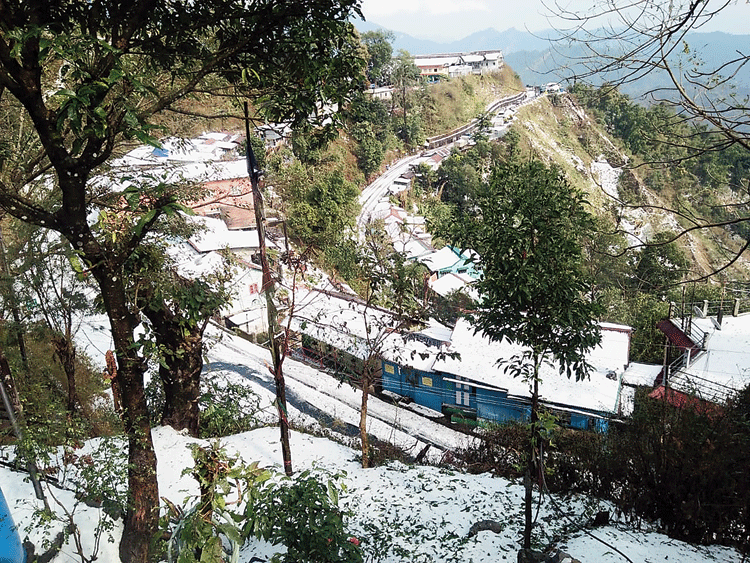 Homes wrapped in a white blanket at Tindharia