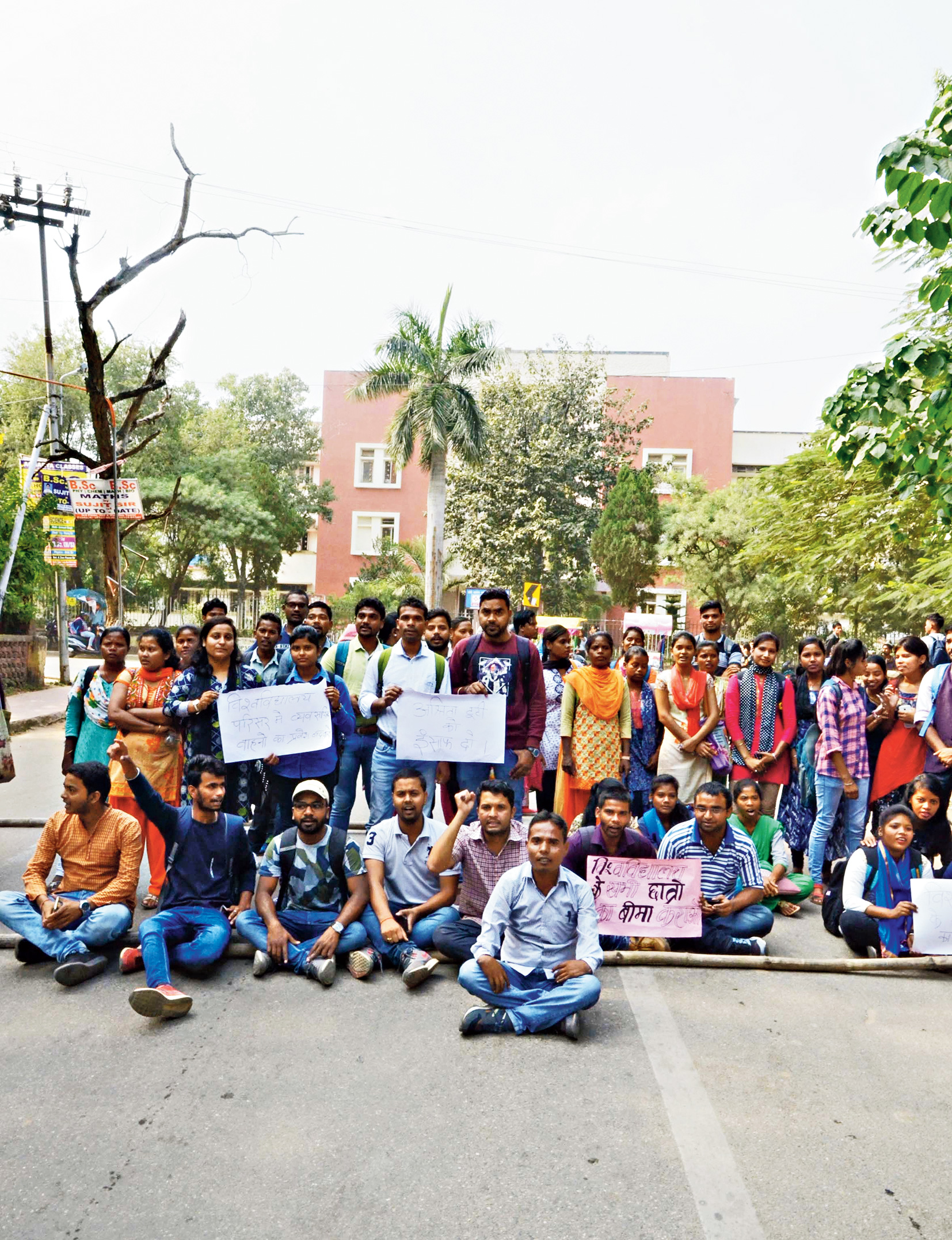 Adivasi Chatra Sangh members block Morabadi Road seeking a ban on entry of heavy vehicles inside the Ranchi University campus.
