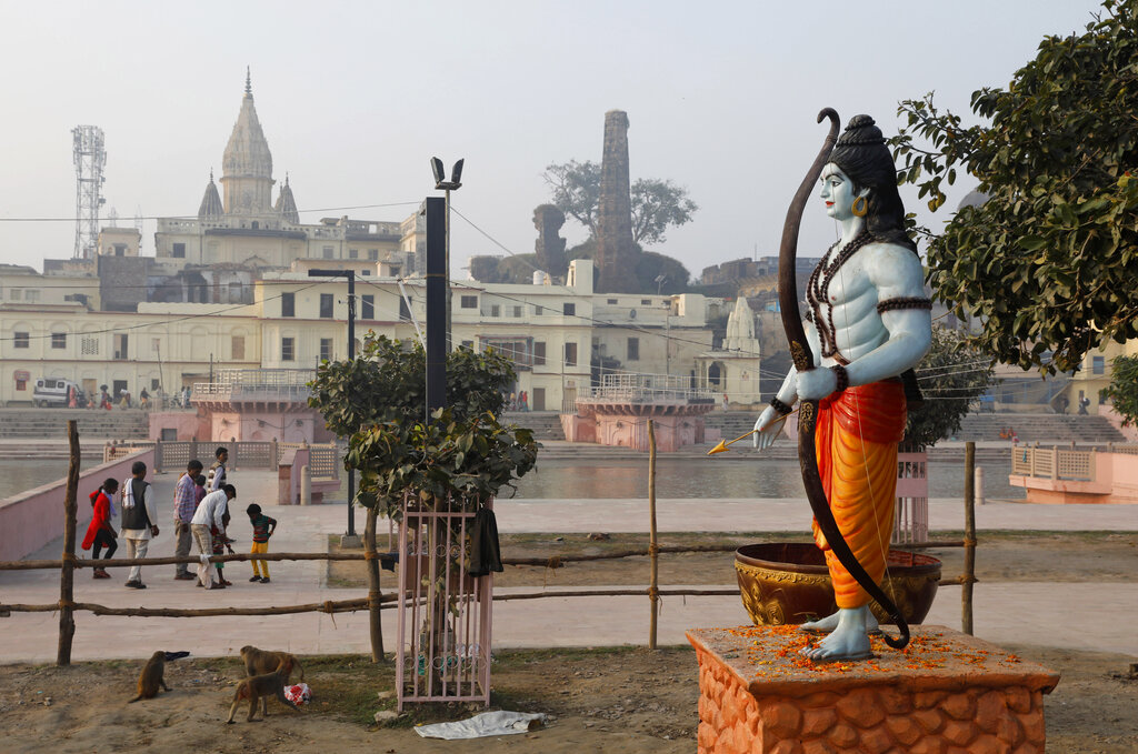 A statue of Hindu god Rama stands beside the River Sarayu in Ayodhya, Saturday, Nov. 9, 2019.