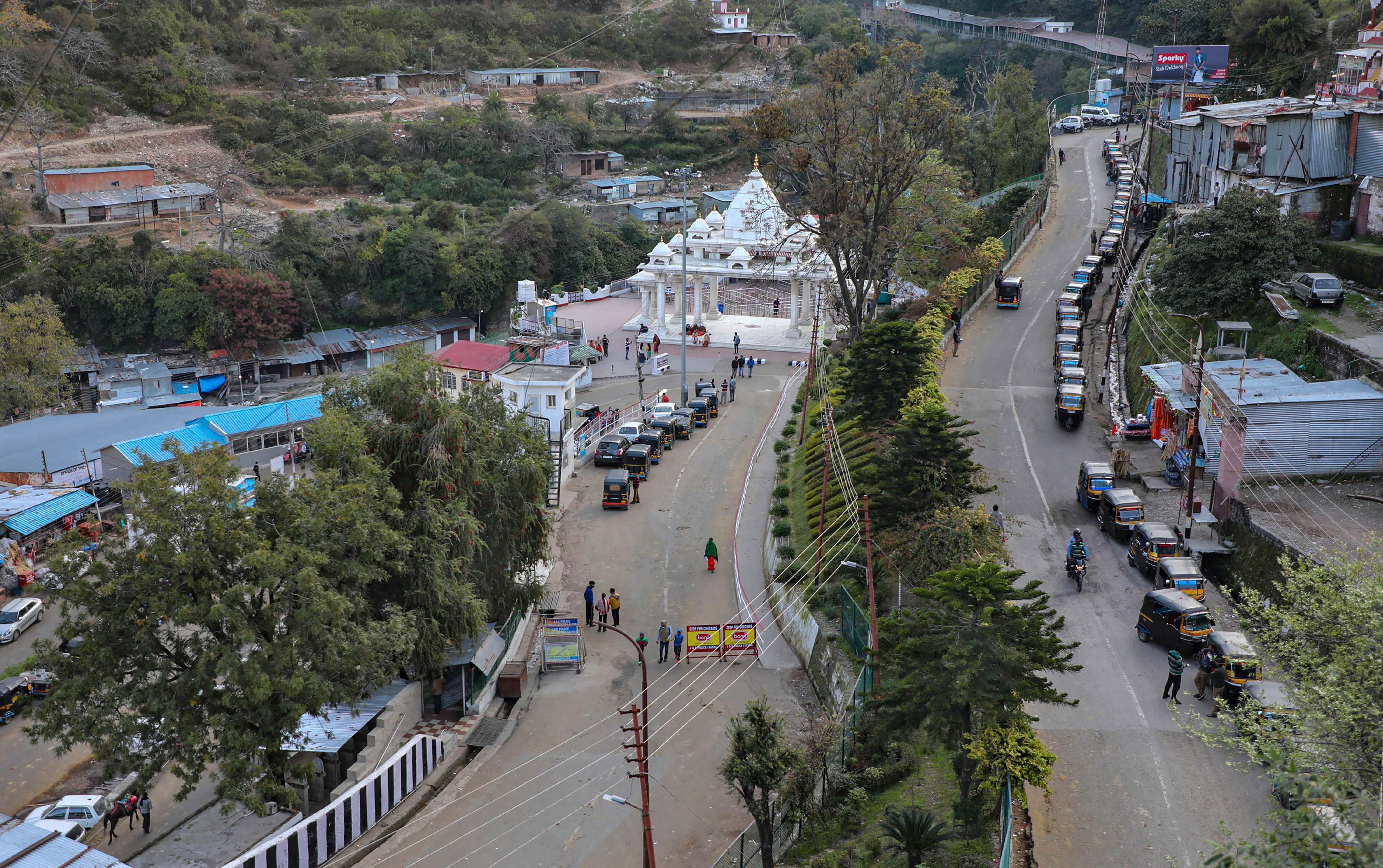Roads leading towards Ban Ganga Darshani Deodi wears a deserted look after the government suspended pilgrimage amid coronavirus threat, at Katra about 45km from Jammu, Thursday, March 19, 2020