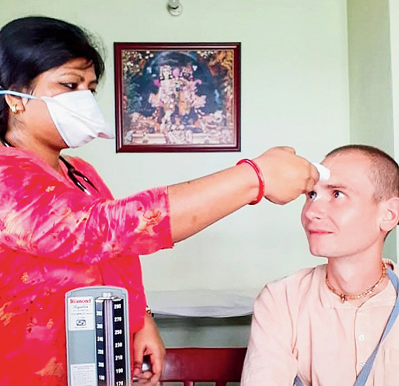 A devotee (right) being checked at the Iskcon’s community hospital in Mayapur
