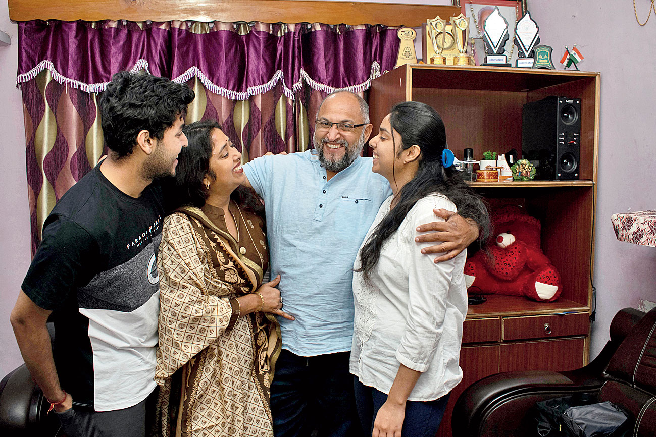 Associated Press photographer Channi Anand celebrates with his family.