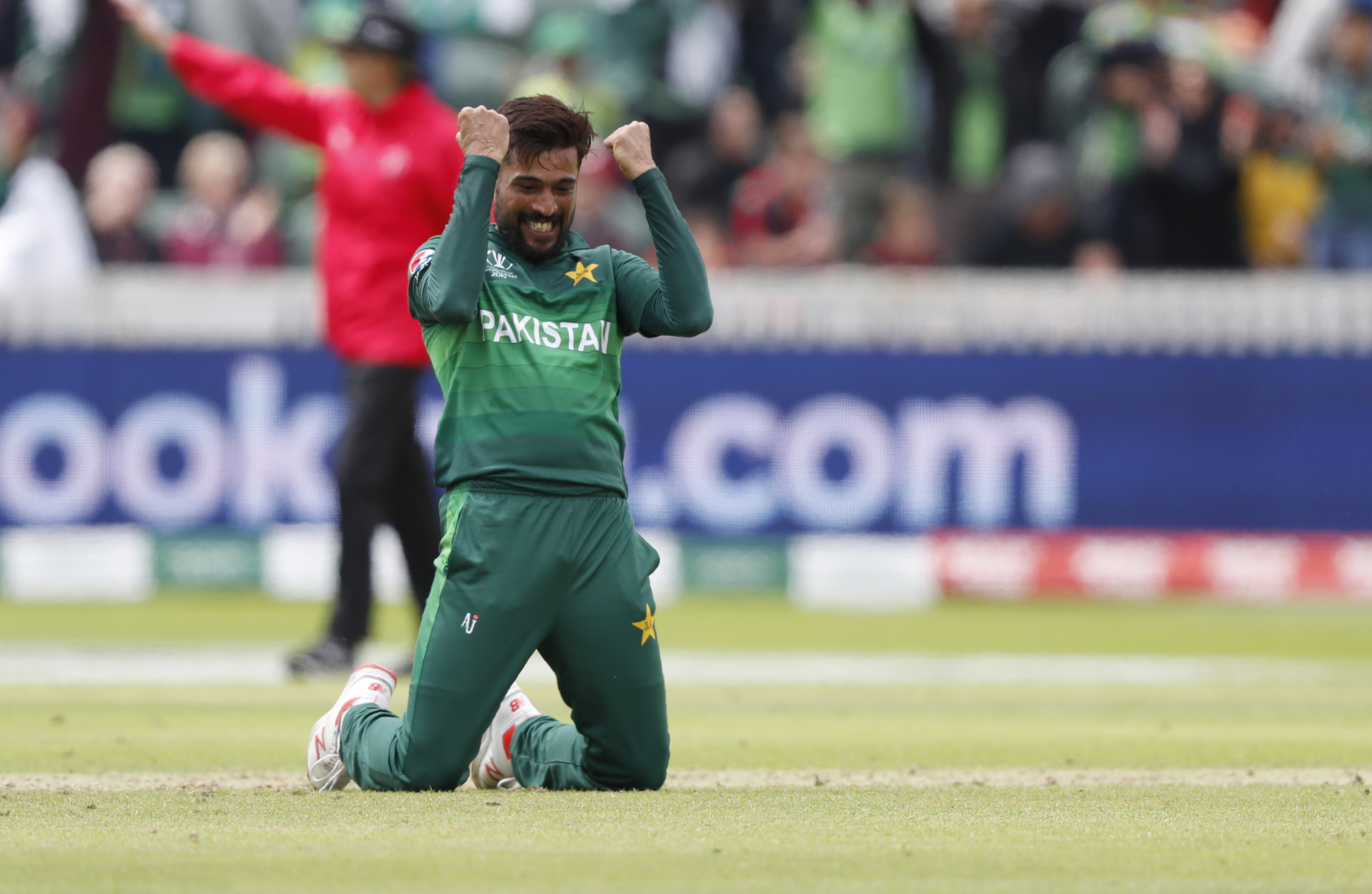 Pakistan's Mohammad Amir celebrates after taking the wicket of Australia's Mitchell Starc at the County Ground in Taunton on June 12.