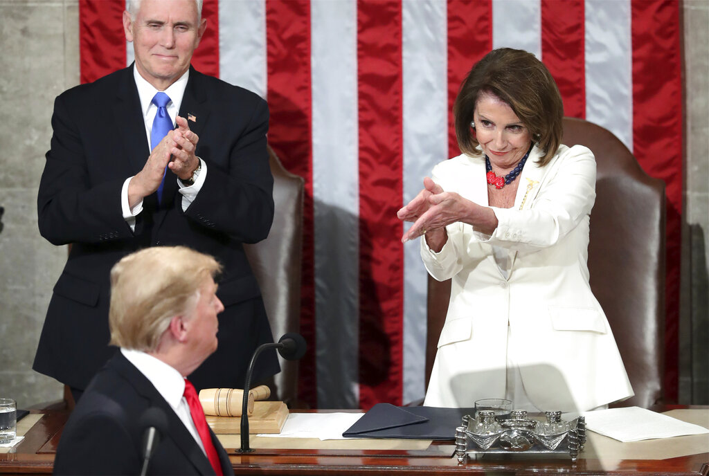 Donald Trump turns to House Speaker Nancy Pelosi as he delivers his State of the Union address.