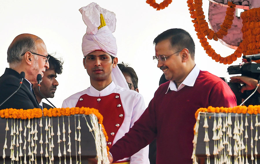 Delhi lieutenant-governor Anil Baijal (left) greets AAP convener Arvind Kejriwal after he took oath as the chief minister of Delhi for the third consecutive time, at a ceremony in the Ramlila Maidan in New Delhi, on Sunday, February 16, 2020.
