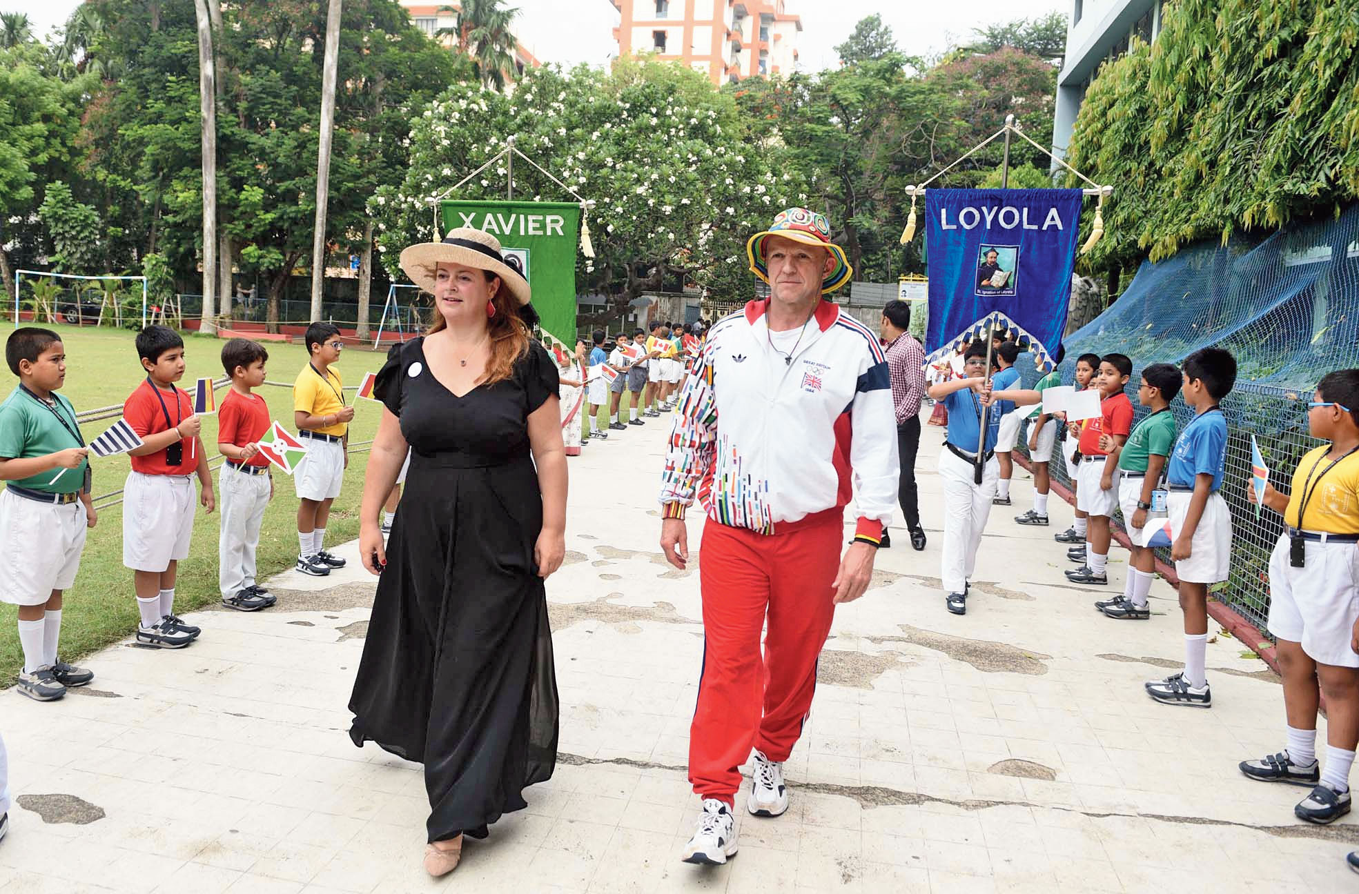 Roald Bradstock and Dianne De Navacelle get a guard of honour at St Lawrence School on Thursday