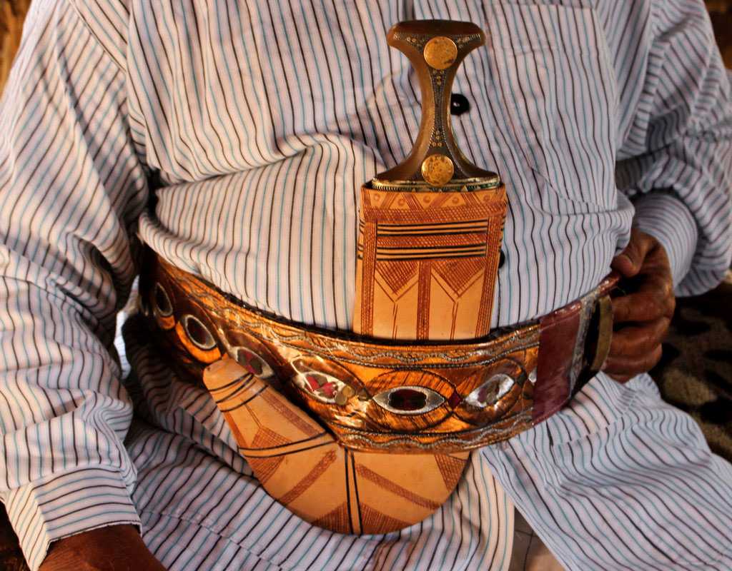 A man wears a dagger or 'Jambiyya' in Yemeni Arabic, made out of remains of missiles, in Hajjah, Yemen.