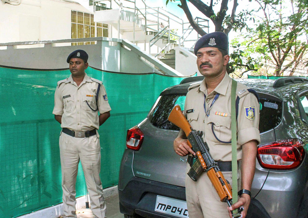 CRP personnel stand guard at the main gate of Nadir Colony as Income Tax department officials raid the residential premises of Praveen Kakkar, OSD to Chief Minister Kamal Nath, in Bhopal on Sunday, April 7, 2019.