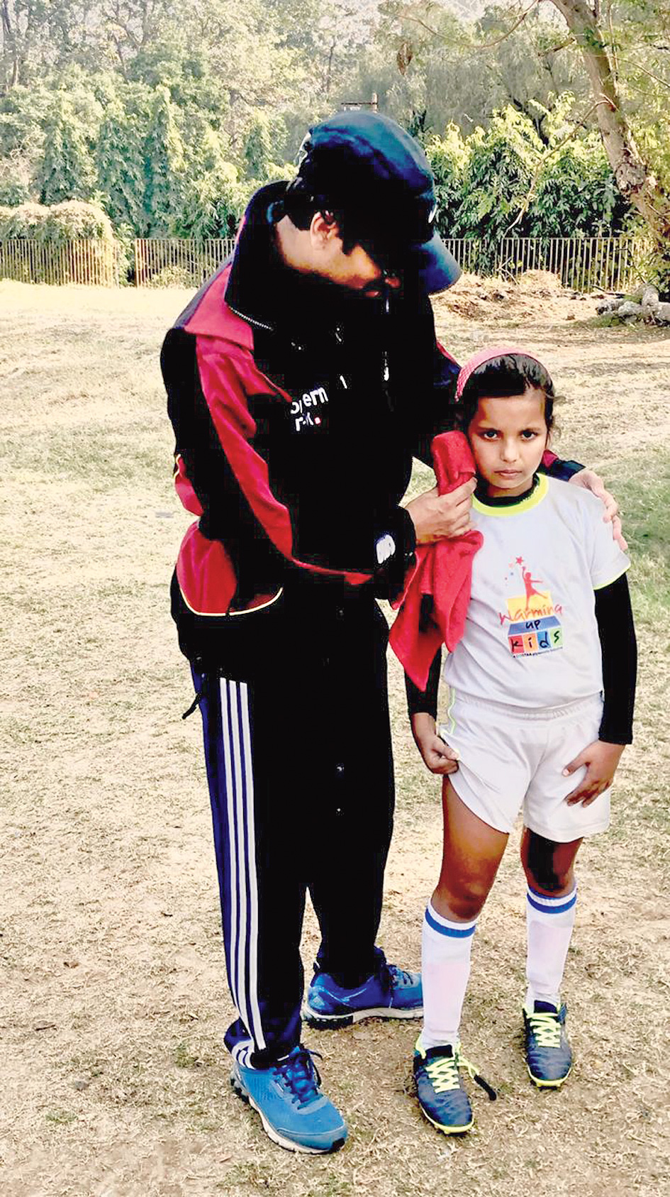 Aadya Das with her trainer being treated with ice pack.