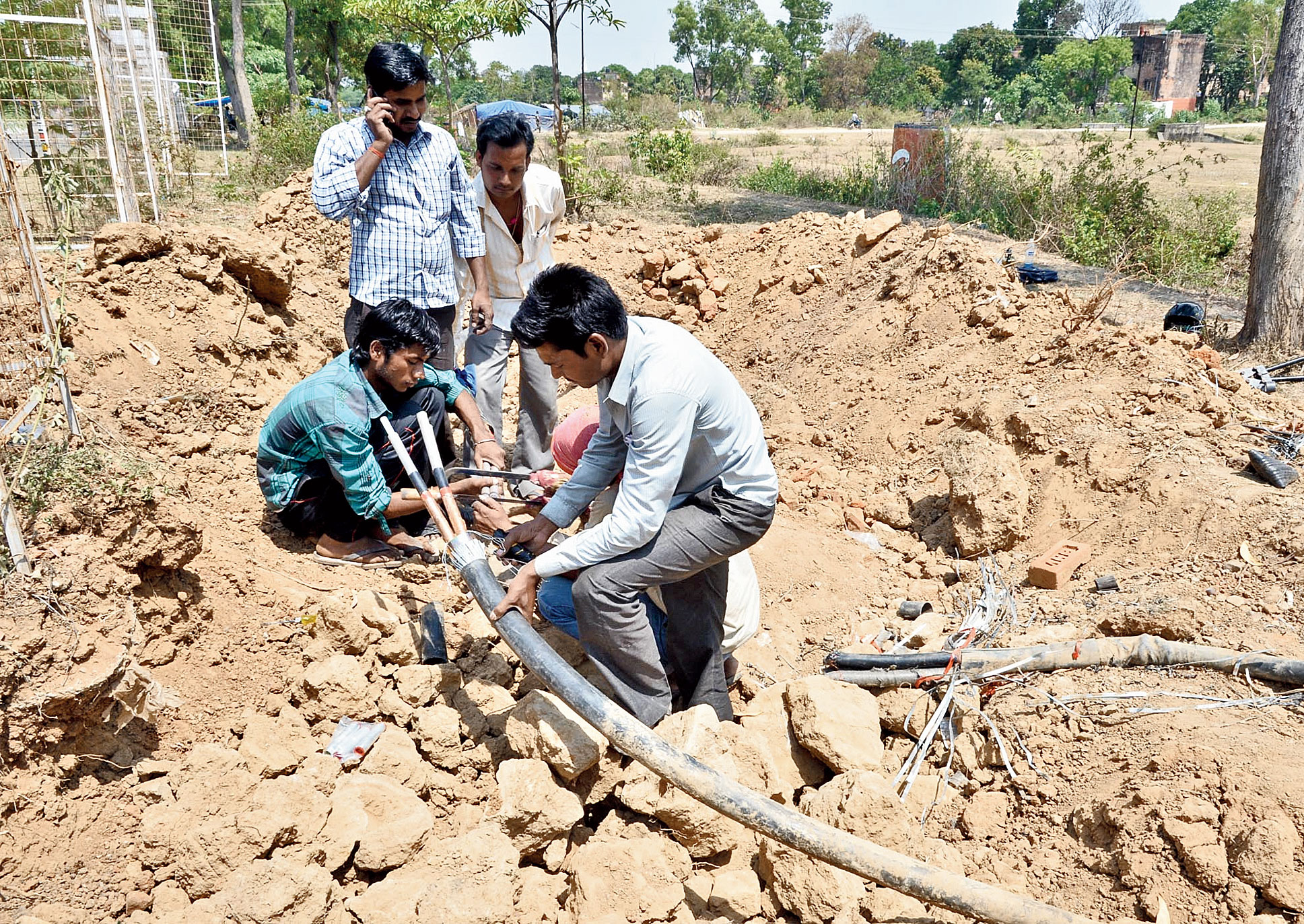 JBVNL  workers lay underground cables at HEC township in Ranchi. 
