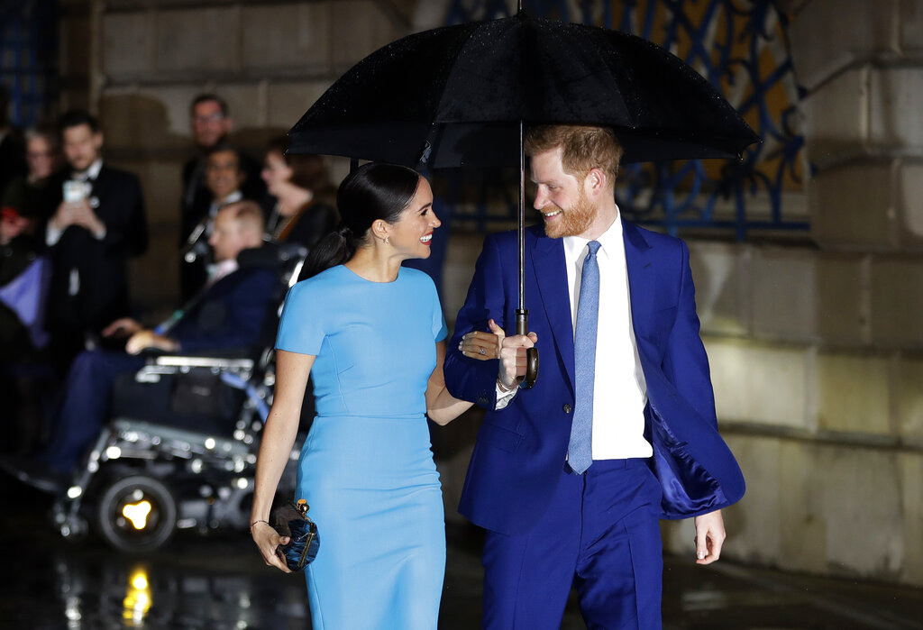 In this Thursday, March 5, 2020 file photo, Britain's Prince Harry and Meghan Markle, the then Duke and Duchess of Sussex arrive at the annual Endeavour Fund Awards in London.