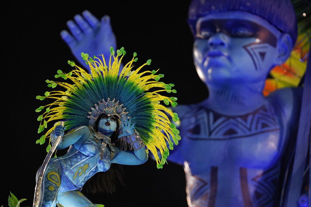 A performer from the Vila Isabel samba school parades on a float during Carnival celebrations at the Sambadrome in Rio de Janeiro, Brazil
