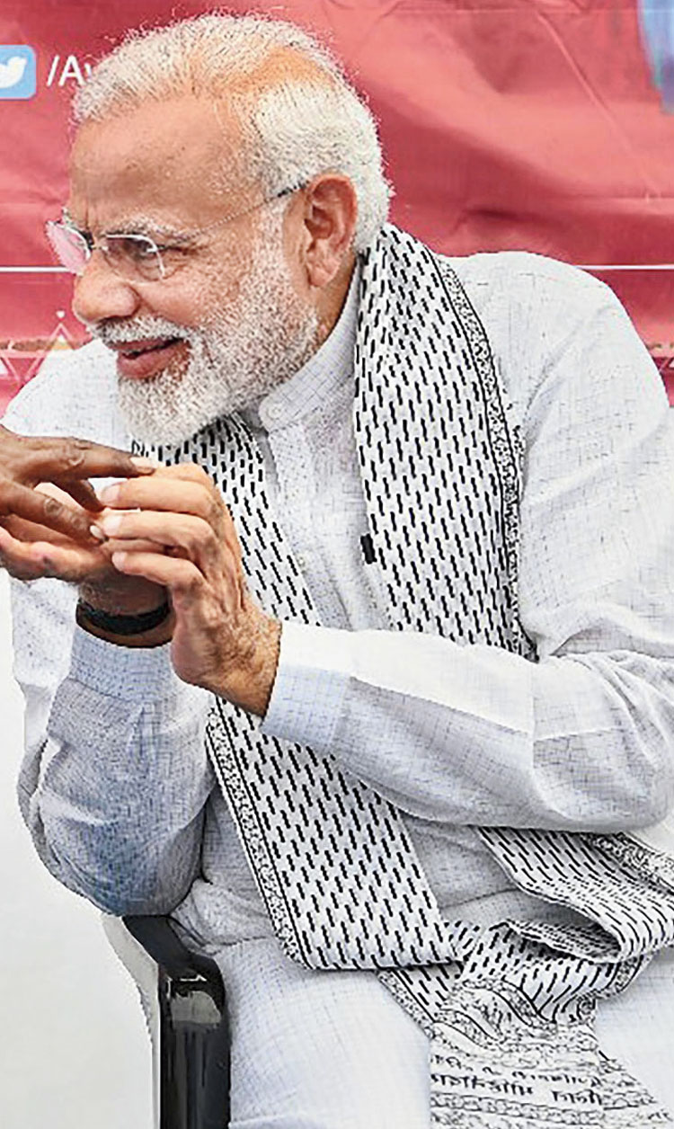 February 16: In Maharashtra for the Pradhan Mantri Awas Yojana, marked by black-printed scarf.